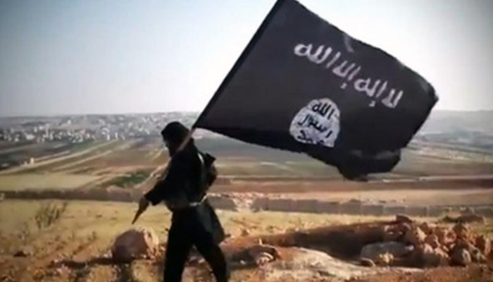 An image grab taken from a video uploaded on YouTube on August 23, 2013 allegedly shows a member of Ussud Al-Anbar (Anbar Lions), a Jihadist group affiliated to the Islamic State of Iraq and the Levant , Al-Qaeda's front group in Iraq, holding up the trademark black and white Islamist flag at an undisclosed location in Iraq's Anbar province. Attacks in Iraq killed 14 people including six soldiers on August 25, Iraqi officials said, amid a surge in violence authorities have so far failed to stem despite wide-ranging operations targeting militants. Arabic writing on the flag reads: "There is not God but God and Mohammed is the prophet of God." AFP PHOTO / YOUTUBE == RESTRICTED TO EDITORIAL USE - MANDATORY CREDIT "AFP PHOTO / YOUTUBE " - NO MARKETING NO ADVERTISING CAMPAIGNS - DISTRIBUTED AS A SERVICE TO CLIENTS FROM FROM ALTERNATIVE SOURCES, THEREFORE AFP IS NOT RESPONSIBLE FOR ANY DIGITAL ALTERATIONS TO THE PICTURE'S EDITORIAL CONTENT, DATE AND LOCATION WHICH CANNOT BE INDEPENDENTLY VERIFIED ====