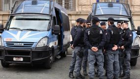 ROME, ITALY - MARCH 11: Police gather near to the entrance to Vatican City on March 11, 2013 in Rome, Italy. Cardinals are set to enter the conclave to elect a successor to Pope Benedict XVI after he became the first pope in 600 years to resign from the role. The conclave is scheduled to start on March 12 inside the Sistine Chapel and will be attended by 115 cardinals as they vote to select the 266th Pope of the Catholic Church. (Photo by Dan Kitwood/Getty Images)