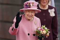 (FILES) In this file photo taken on October 14, 2021 Britain's Queen Elizabeth II waves as she leaves after attending the ceremonial opening of the sixth Senedd, the Welsh Parliament, in Cardiff, Wales. - Queen Elizabeth II spent Wednesday night in hospital, Buckingham Palace have reported, Thursday October 21. (Photo by Jacob King / POOL / AFP)